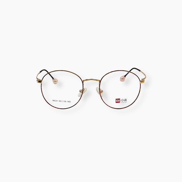 نظارة EYEWEAR موديل 9824، بتصميم لؤلؤ ناعم وإطار معدني ذهبي.