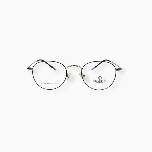 نظارة طبية كلاسيكية للجنسين من SEATTLE EYEWEAR موديل 55724، بتصميم دائري أنيق وإطار معدني رفيع.